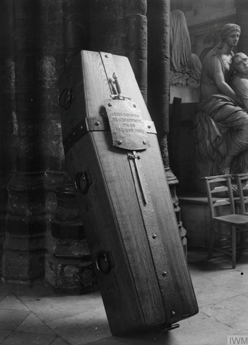 The Coffin of The Unknown Warrior (IWM Q 31492 ) In order to commemorate the many soldiers with no known grave, it was decided to bury an 'Unknown Warrior' with all due ceremony in Westminster Abbey on Armistice Day in 1920. A view of the coffin of the Unknown Soldier in Westminster Abbey, November 1920, showing the inscription on the beaten iron plate. The coffin is propped up to almost vertical on a stand. (C) IWM Q 31492
