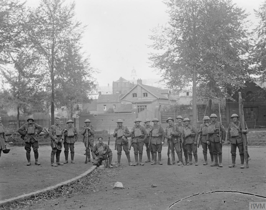 Capture of Cambrai by the British 57th Division, Soldiers of the Loyal North Lancashire Regiment on return from a patrol in Cambrai, 9 October 1918. © IWM Q 11366