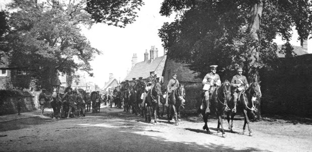 Manoeuvres, 1913. A Royal Artiller column passing through a Buckinghamshire village (Photo: NAM 15495)