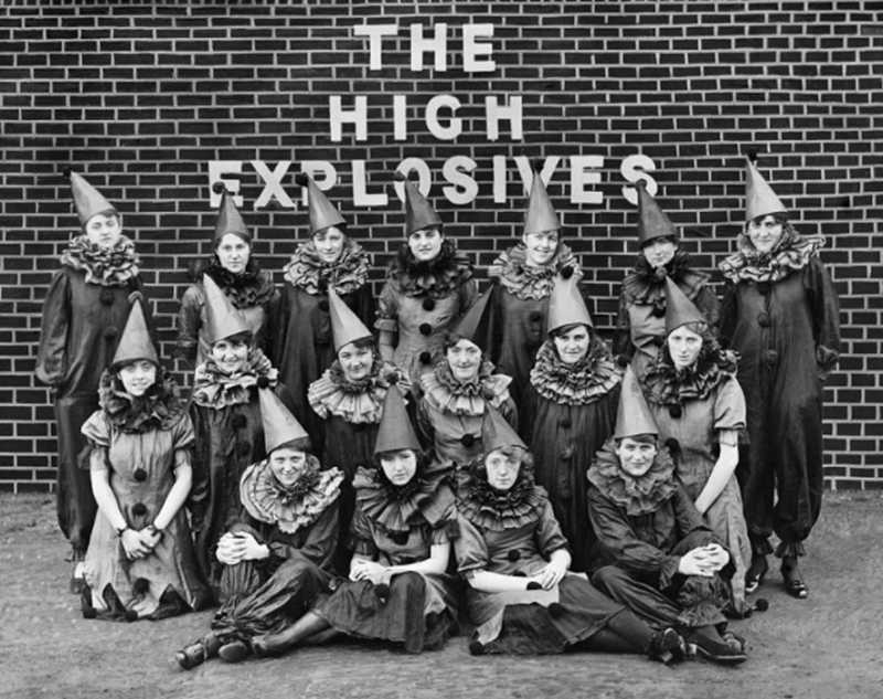 An all-female work force at The Cunard Shell Works, Rimrose Road, Bootle, Sefton, photographed in 1917. The Cunard Shell Works was probably the largest single commission that the firm ever received. This photograph shows the factory’s all-female concert party, ‘The High Explosives’, in costume © The Historic England Archive, Historic England  (2022)