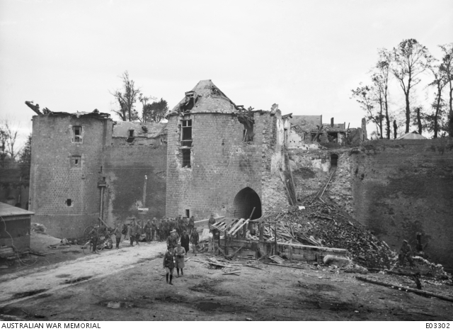 The Right Honourable W. M. Hughes Prime Minister Of Australia Being Conducted On A Tour Of Inspection Through The Ruins Of Peronne. The Building In The Background Is The Entrance To The Citadel.