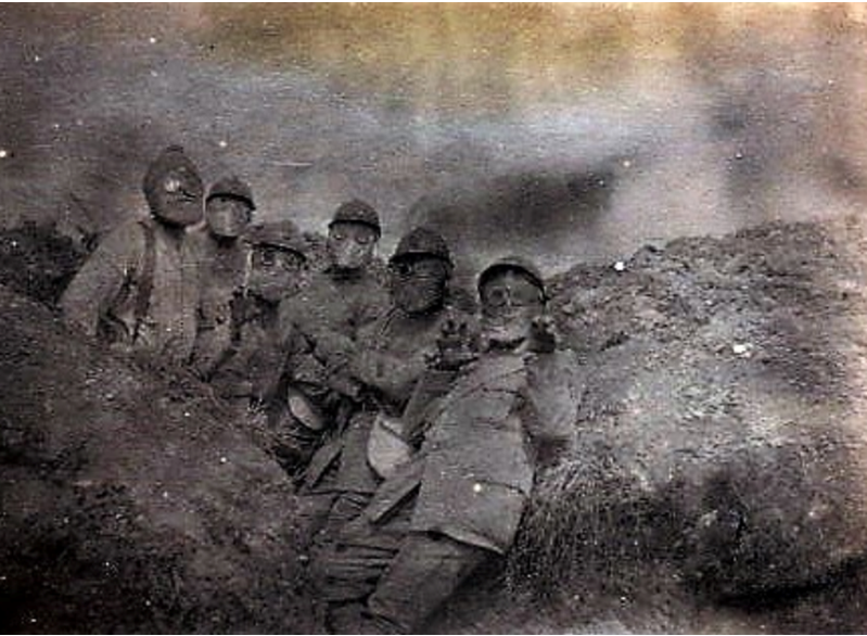 Original caption ‘Carnival scene at the ‘Cote du Poivre’  French soldiers with gas masque Verdun 1916. © Francois Wicart : Private Collection