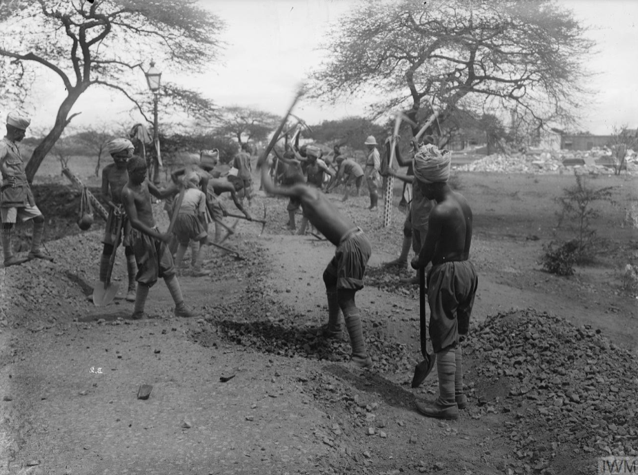 Troops of the 18th Battalion, Indian Labour Corps constructing a road. © IWM Q 52591