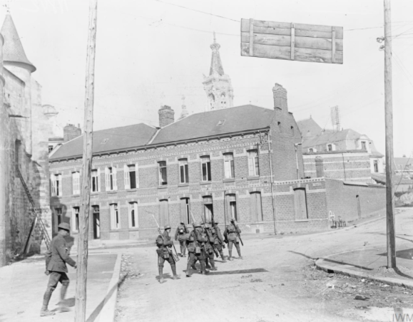 Capture of Cambrai by the British 57th Division. A patrol of the Loyal North Lancashire Regiment in the southern suburbs of Cambrai, 9 October 1918. ©  Q11369