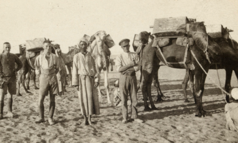 British soldiers with members of the Egyptian Camel Transport Corps, carrying water for troops, Sheik Nakhrur, 1917