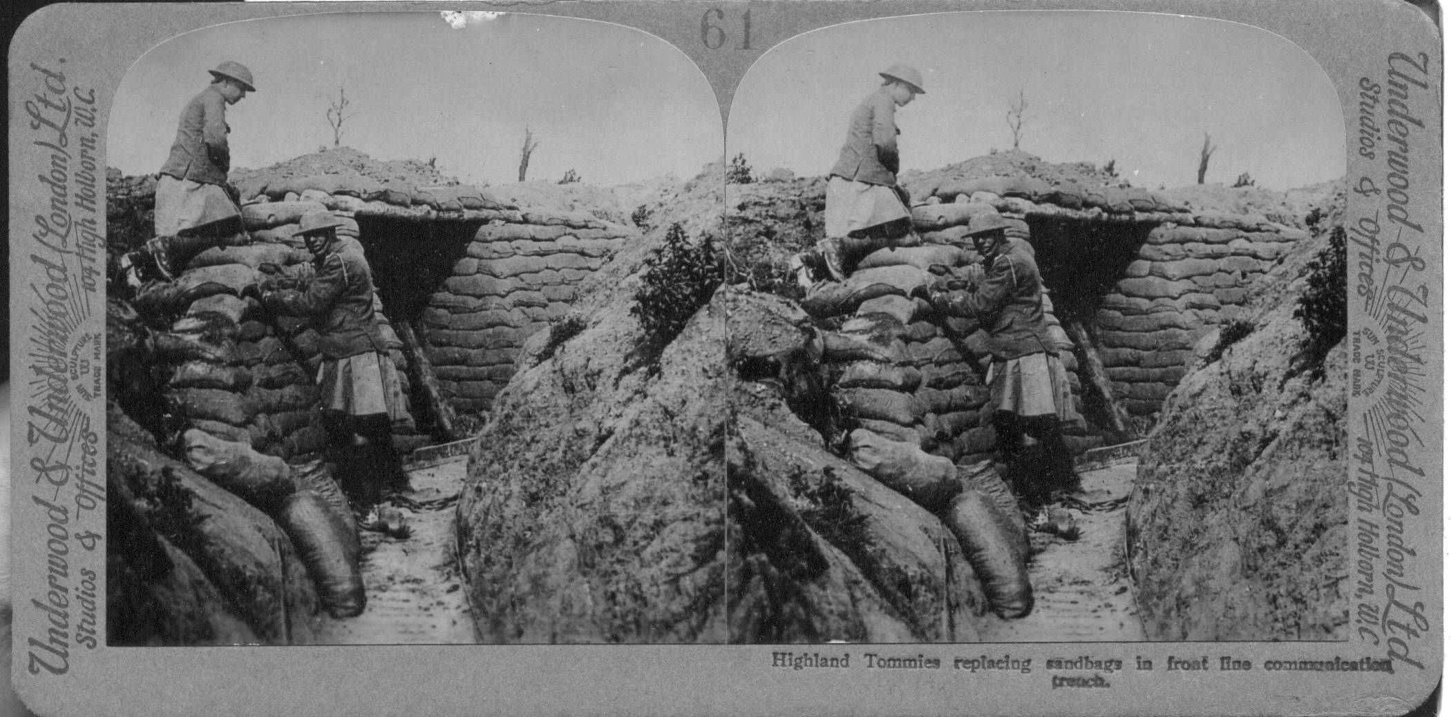 Highland Tommies replacing sandbags in front line communication trench