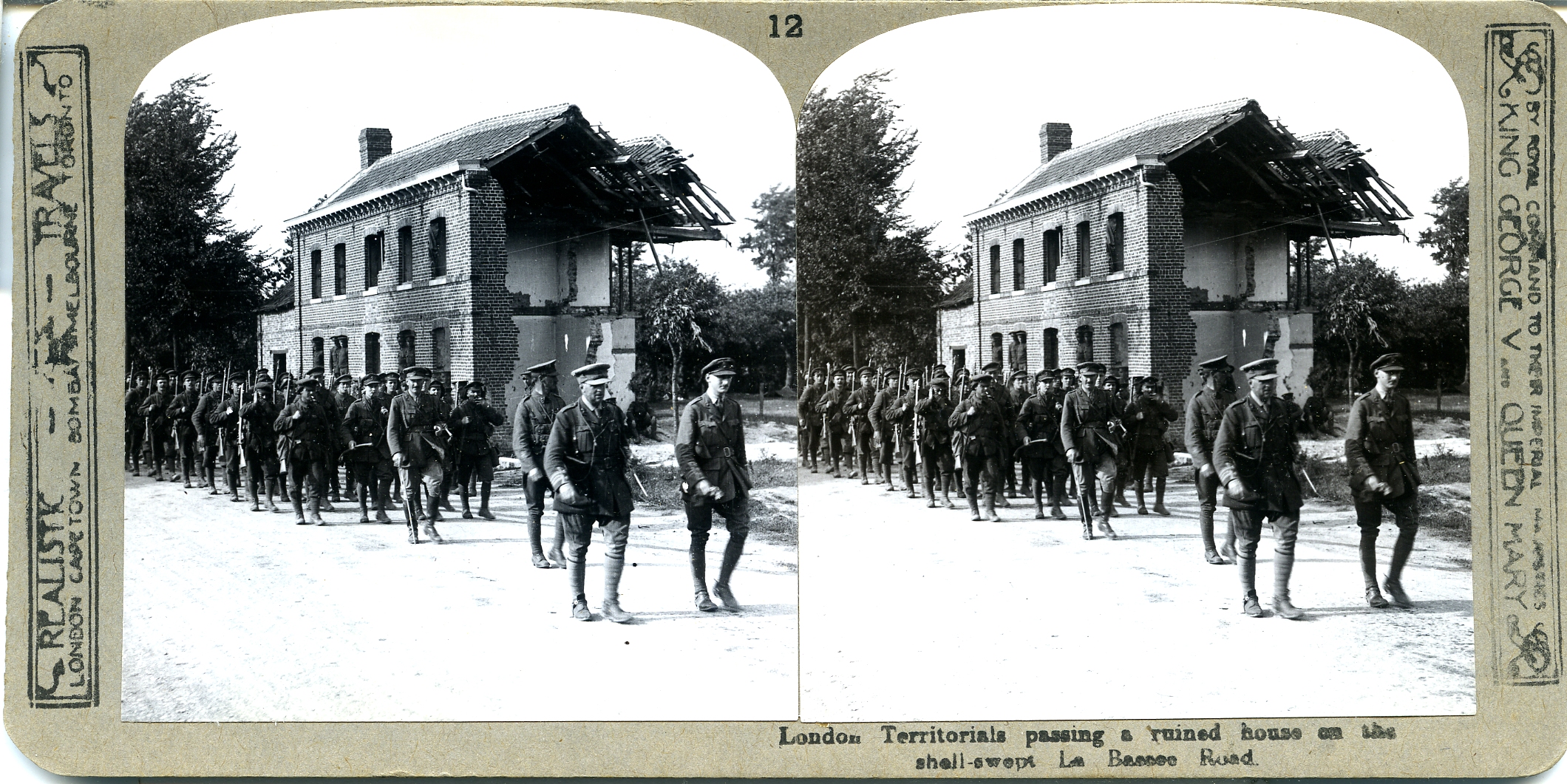 London Territorials pass the wrecked Doll's house on the shell-swept La Brassee (sic) road