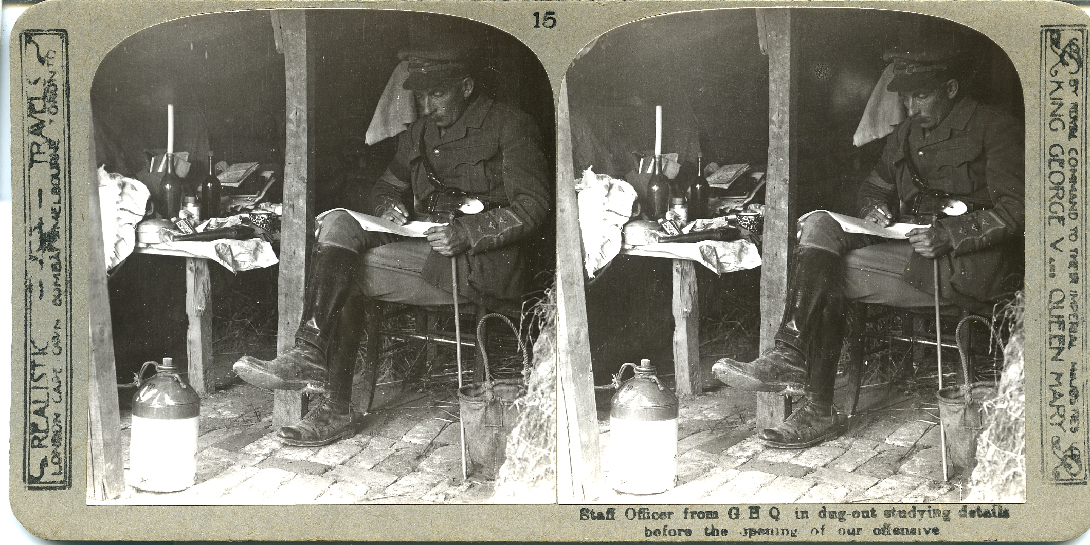 Staff Officer from G.H.Q. in dug-out, studying details before the opening of our offensive