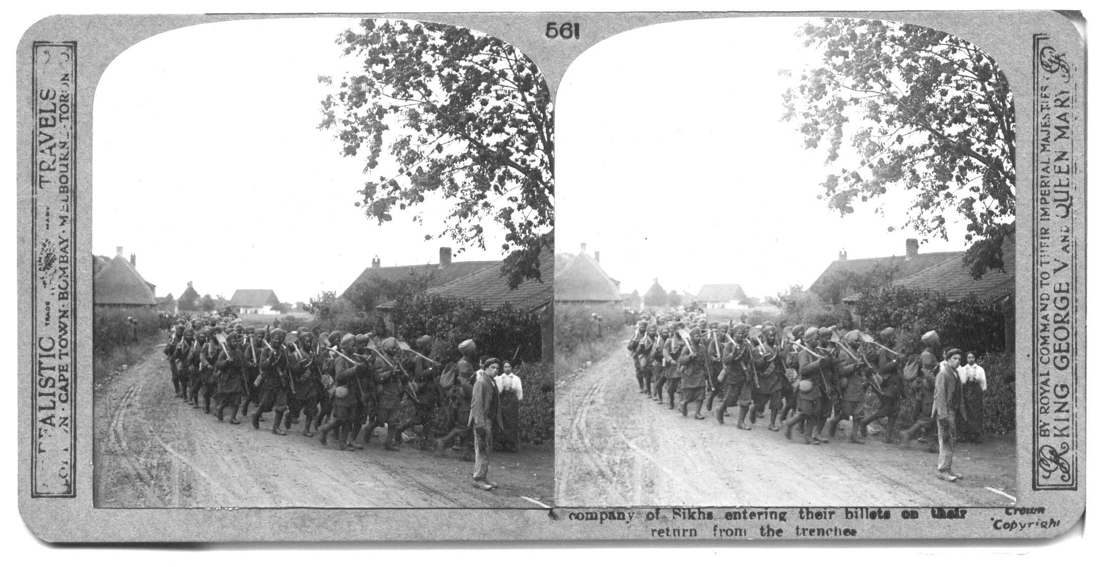 A company of Sikhs entering their billets on their return from the trenches