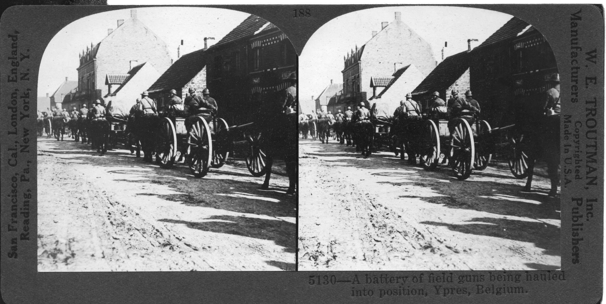 A battery of field guns being hauled into position, Ypres, Belgium