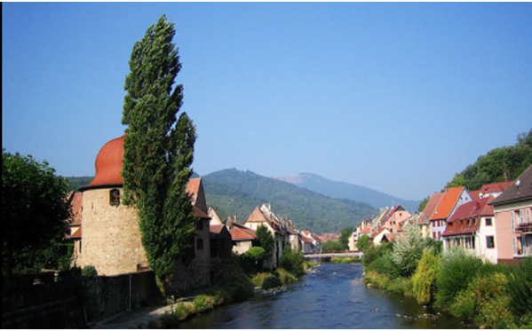 La Tour des Sorcières (left) and the River Thur by Runghold (CC BY-SA 4.0)