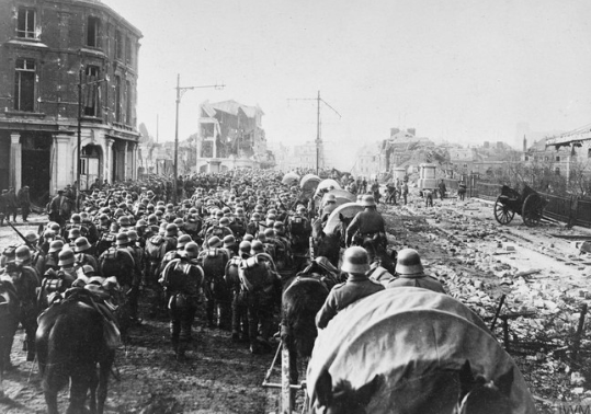 Preparations for the Spring Offensive. German troops concentrating in the wrecked streets of St. Quentin, immediately prior to the Spring Offensive, 19 March 1918. © IWM Q 55479