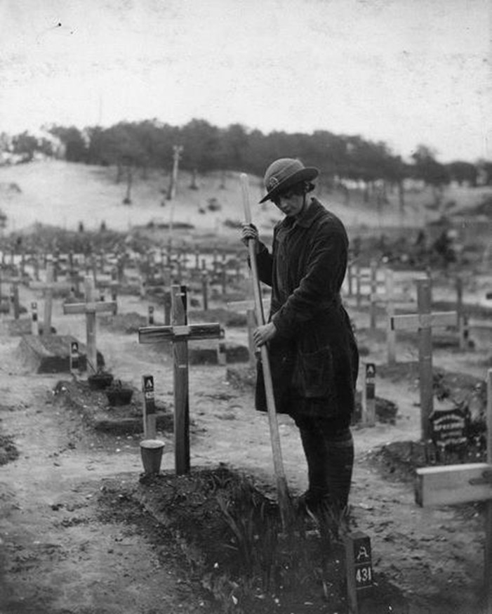 The Grave Of Betty Stevenson Is Tended To By A Member Of The Women's Army Auxiliary Corps (WAAC)