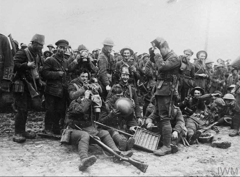 Actions Of St. Eloi Craters. Troops Of The Northumberland Fusiliers, 3Rd Division, Wearing German Helmets And Gas Masks Captured At St. Eloi, 27Th March 1916. IWM Q491
