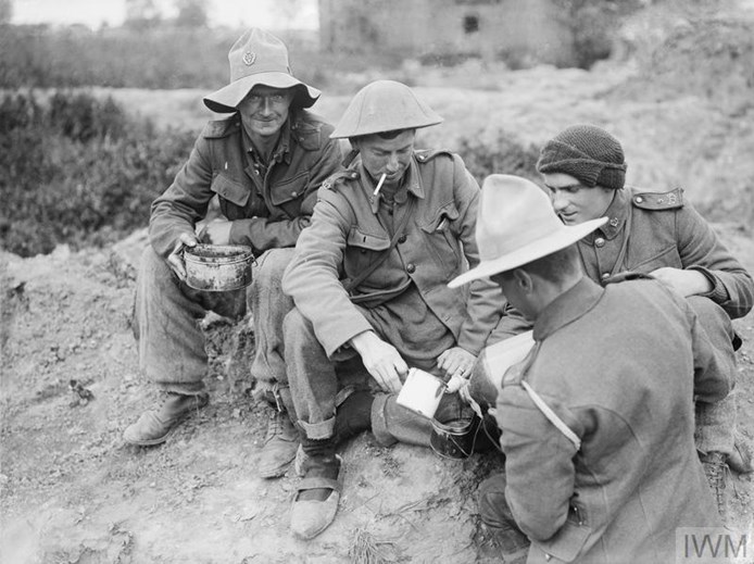 New Zealand Troops Of The 9Th (Wellington East Coast Rifles) Regiment Being Issued With Their Rum Ration At Fleurbaix, June 1916