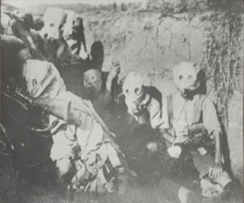 British troops wearing gas masks in the trenches, Salonika, 1917 (from the National Army Museum collection).