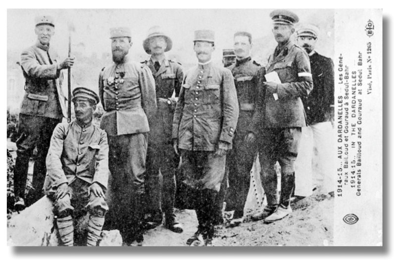 General Henri Gouraud (commander of the French Army Corps in the Dardanelles and third from the left) and General Maurice Bailloud (commander of the French 2nd Division and on the extreme left), stand with their staff by a wrecked gun in the old fort at Sedd el Bahr, Cape Helles. (C) National Army Museum 2021