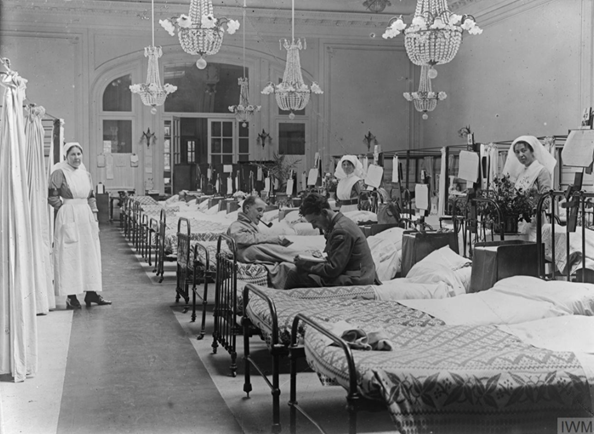 Voluntary Aid Detachment, Order of St John (VAD) nurses and convalescents on a ward in the Duchess of Westminster's (No.1 Red Cross) Hospital at Le Touquet (Le Touquet-Paris-Plage), 18th June 1917. © IWM Q 2404