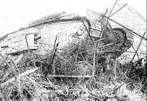 Tank versus barbed wire, October 1918. But tanks were "too slow, too unreliable and too vulnerable" to be war-winners. (Photo: IWM Q 6425)