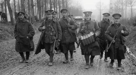 British troops returning from leave, Mailly Maillet, November 1916. The group of soldiers includes men of the Lancashire Fusiliers, York and Lancaster Regiment, and the Duke of Wellington's Regiment (West Riding), from the 49th Division.