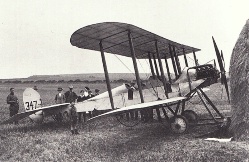 Lieut. H D Harvey-Kelly rests his BE2A near whitby, Yorkshire, in August 1914, during a stop in a flight south from Montrose. He is recumbent against the haystack - bottom right. Photograph CC BY SA 3.0 MylesKelly