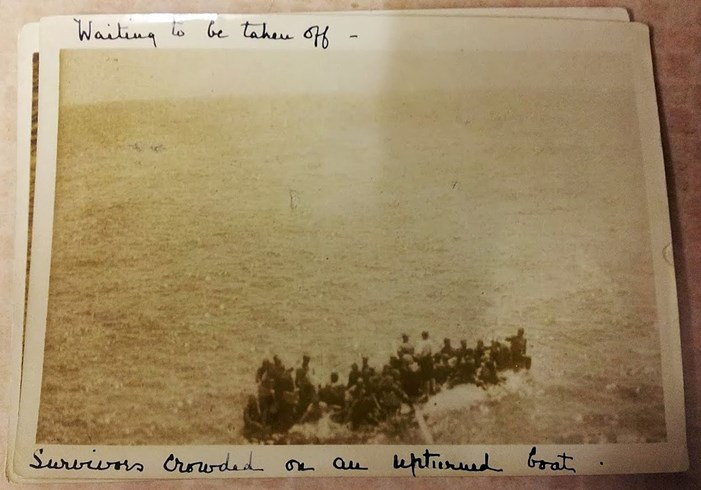 Survivors of HMT Royal Edward on an upturned boat