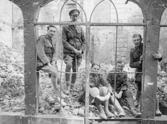 Officers of the 7th (Service) Battalion (Pioneers), York and Lancaster Regiment, in a ruined building in Arras, 30 April 1917.