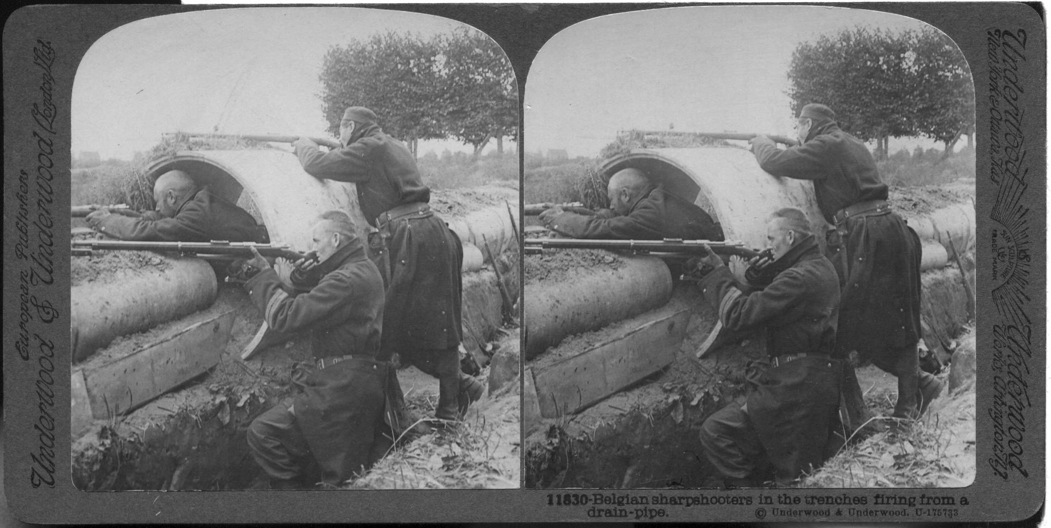 Belgian sharpshooters in the trenches firing from a drain-pipe