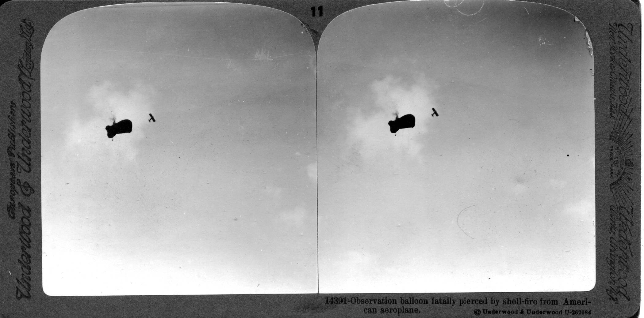 Observation balloon fatally pierced by shell fire from American aeroplane