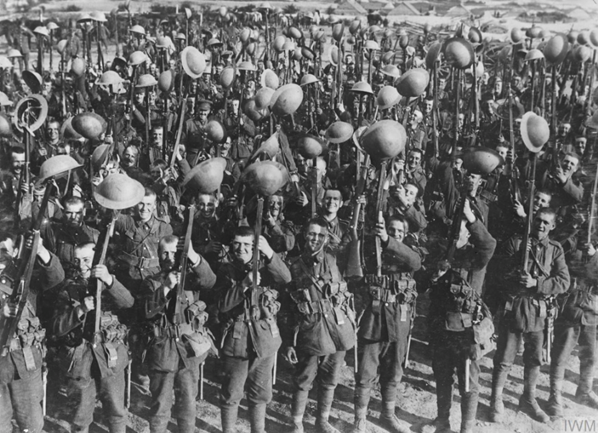 Men of the 7th Pioneer Battalion Durham Light Infantry parading for the trenches; Reninghelst, near Ypres, 29th April 1916. © IWM Q 537