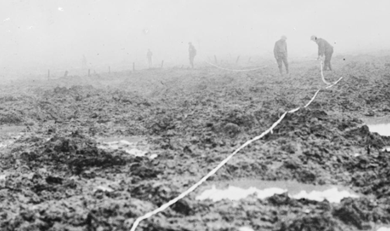 Assault on Passchendaele 12 October - 6 November: Canadian Pioneers laying tape through the mud for a road to Passchendaele © IWM CO 2253