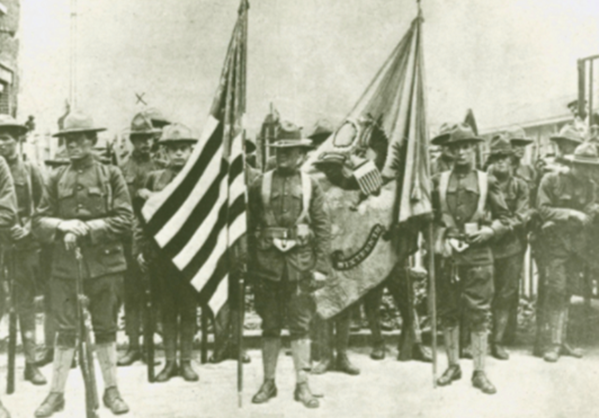 Photograph taken 4 July 1917 during a pause in the parade of elements of the 16th Infantry Regiment participating in the Fourth of July parade in Paris.