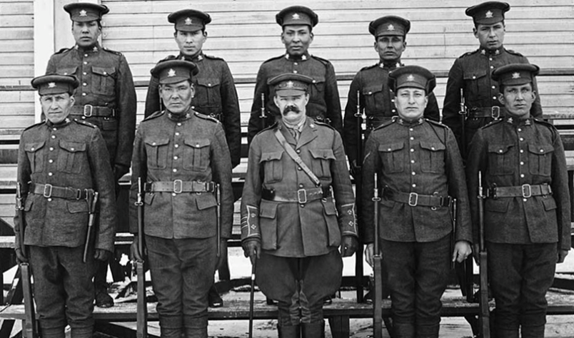 Kainai and Siksika recruits of the 191st Battalion. Mike Mountain Horse is standing in the bottom righthand corner. Credit: Glenbow Archives NA-2164-1 via Alberta Historic Places).