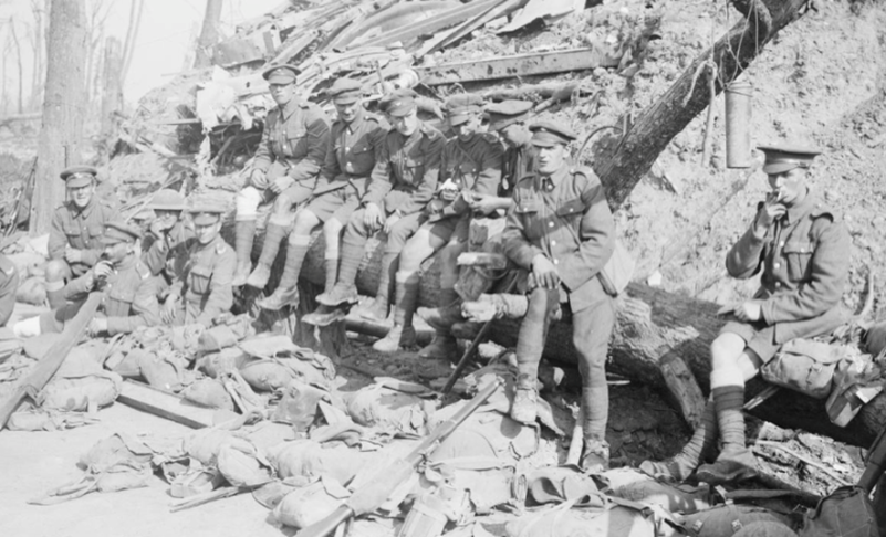 Men of the King's Own Yorkshire Light Infantry resting on the way down from the trenches, near Wieltje, 1 October 1917. IWM Q6026