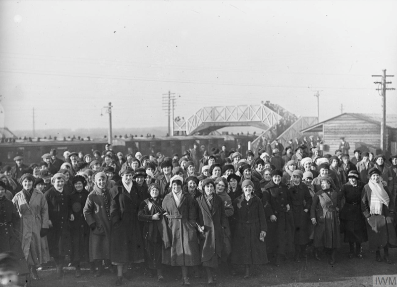 Munitions workers arriving at Gretna Station after a night shift. Photographed by Horace Nicholls. © IWM Q30560