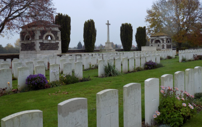 Woburn Abbey Cemetery is situated at Cuinchy, approx 3 1/2 miles west of La Bassee. Guards Cemetery is situated at Windy Corner, Cuinchy about 1 mile north of Woburn Abbey.  CWGC Image > https://bit.ly/3r6XSrb