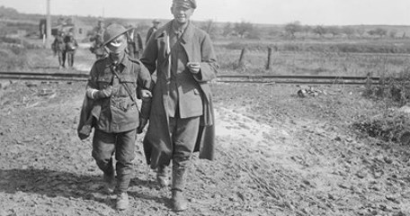 Battle Of Epehy. Wounded And Prisoners Coming In, Near Epehy, 18Th September 1918. The Wounded Soldier In The Foreground Is From A Bantam Unit. © IWM (Q 11329)