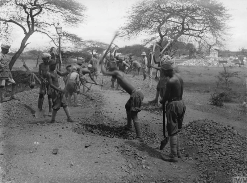 Troops of the 18th Battalion, Indian Labour Corps constructing a road. © IWM Q 52591