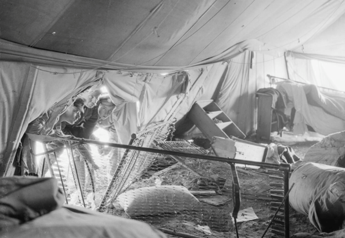 Damage to the interior of a British hospital marquee following a bombing raid by German aircraft in March 1917. (c) IWM Q 32773