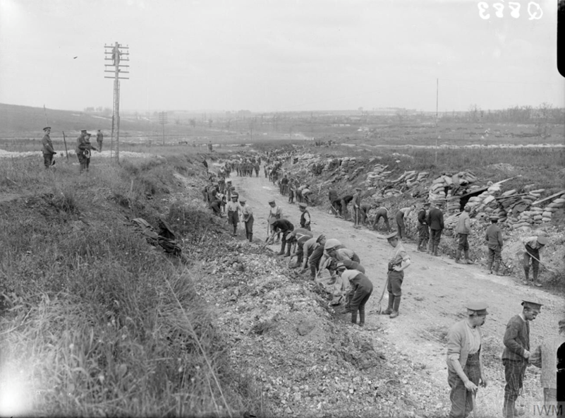 Labour Battalion of one of the regiments repairing a road near Mametz, August 1916. (c) IWM Q 883