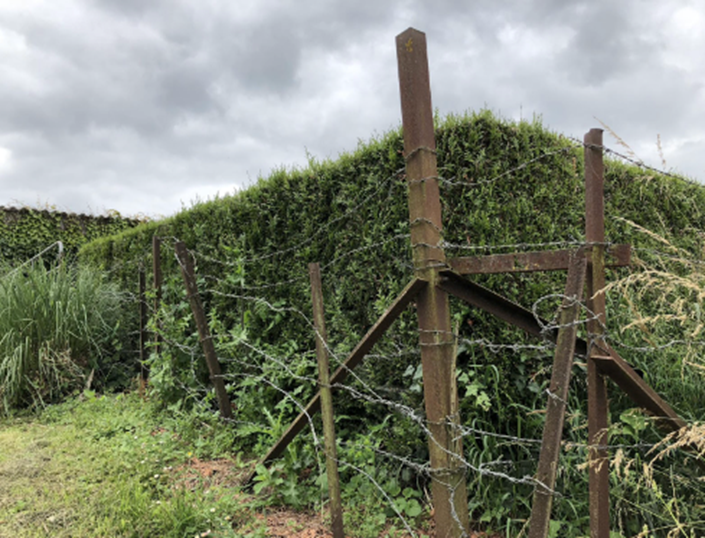 Original barbed wire fencing at the crossroads which marked the dividing line between The 1/6th Battalion, The Royal Warwickshire and 1/8th Battalion, The Royal Warwickshire Regiment