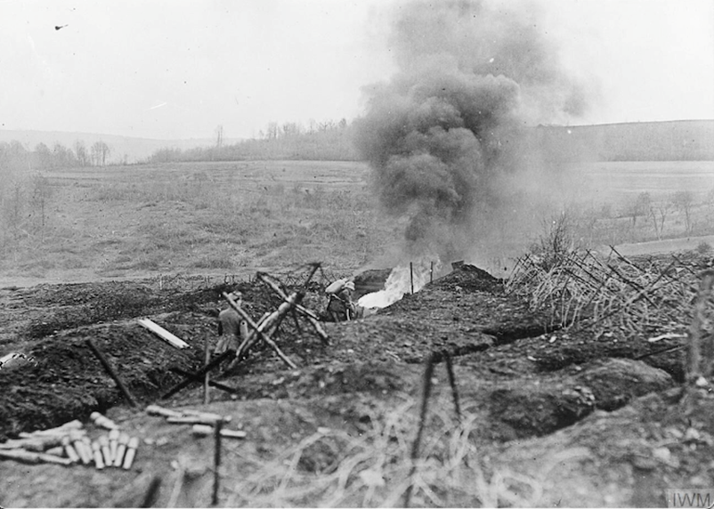 A German soldier practises clearing a trench with a flamethrower during a training session near Sedan in May 1917. IWM Q23759