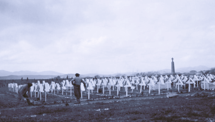 Mudros cemetery containing the graves of Allied soldiers who were killed in the Gallipoli Campaign. A memorial stands in the background. One of a series of photographs taken on the Gallipoli Peninsula under the direction of Captain C. E. W. Bean of the Australian Historical Mission, during the months of February and March, 1919. AWM G02072.