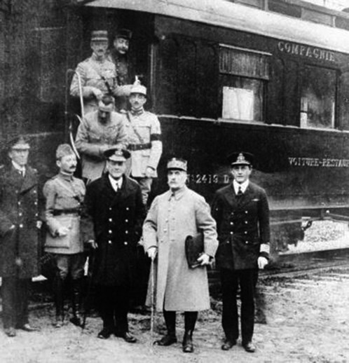 The French Military And British Naval Representatives – Foch And Wemyss Second And Third From Right Respectively – Outside The Railway Carriage In Which The Armistice Was Signed. Courtesy IWM Q43225