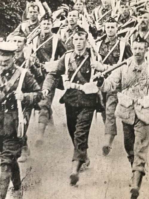William Blumsom (Centre Of The Front Rank) On A Speed March