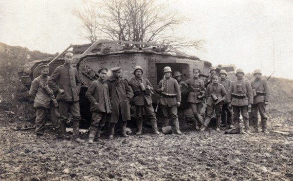 German Troops Pose By The Side Of A Captured British Tank.