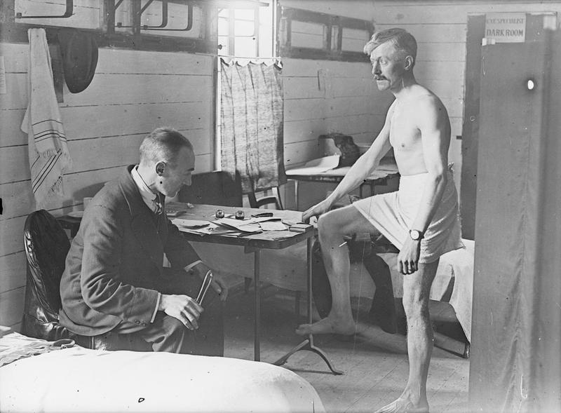 A Medical Officer Examining A Recruit
