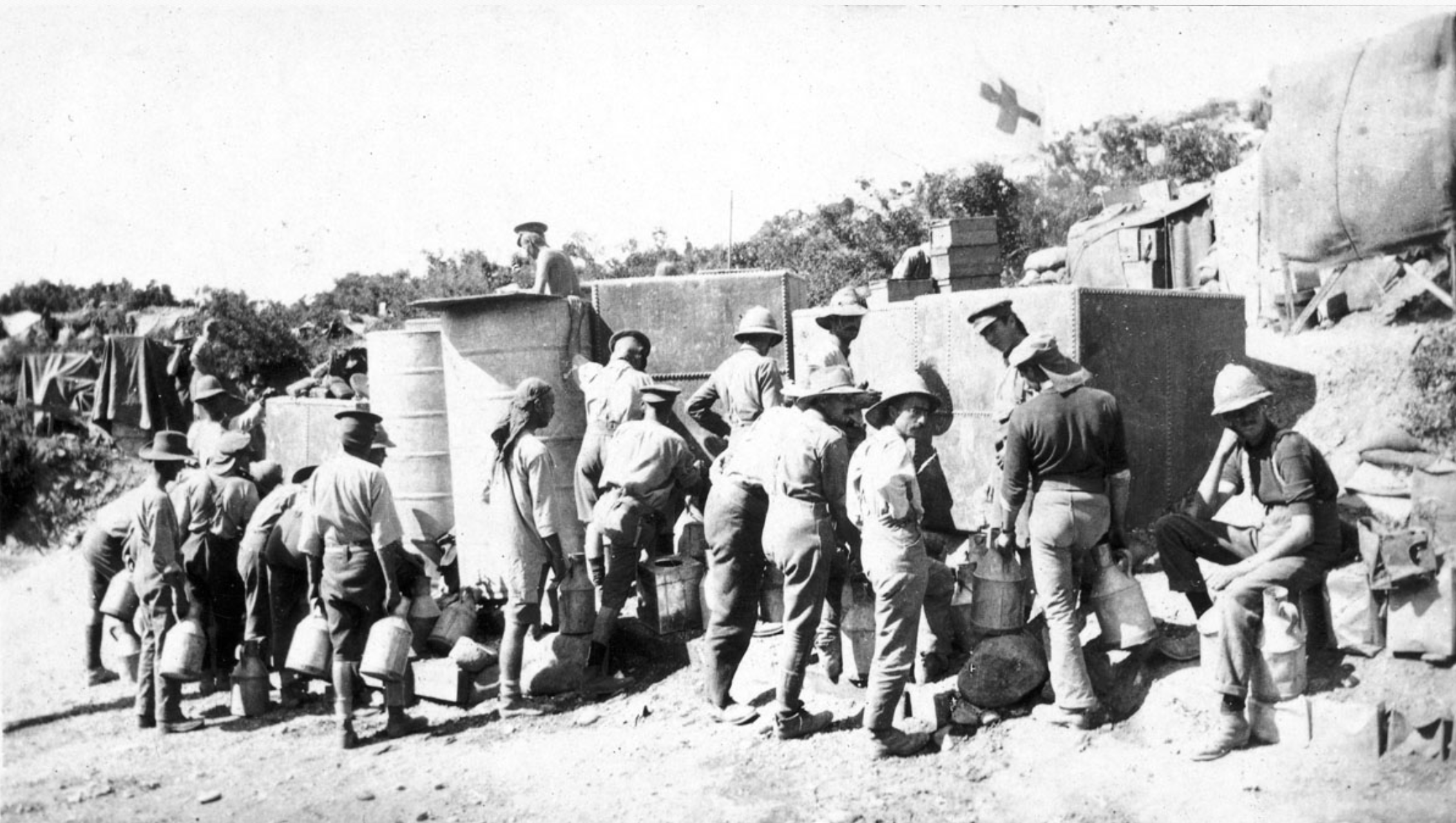 Soldiers Carrying Large Cans Standing Beside Water Tanks At The Foot Of Walker's Ridge, July 1915