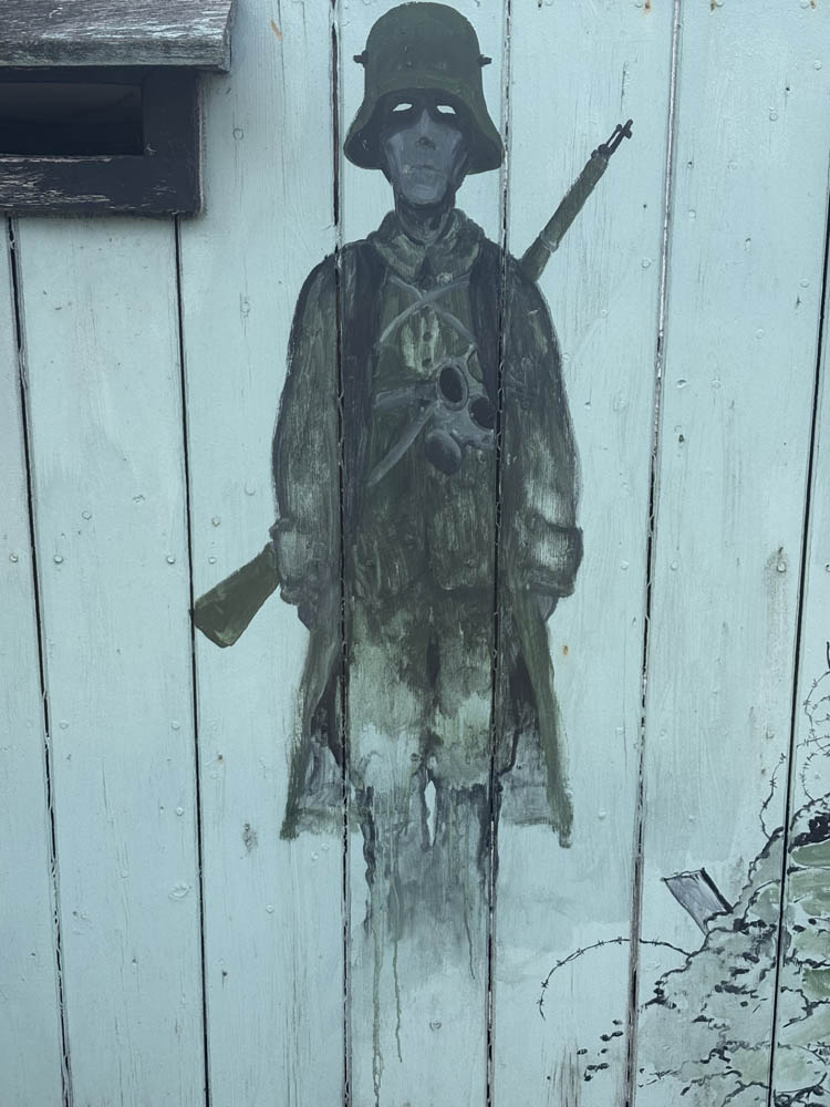 Mural On A Gate Of A German Soldier, Also Armed, Gaunt And Menacing