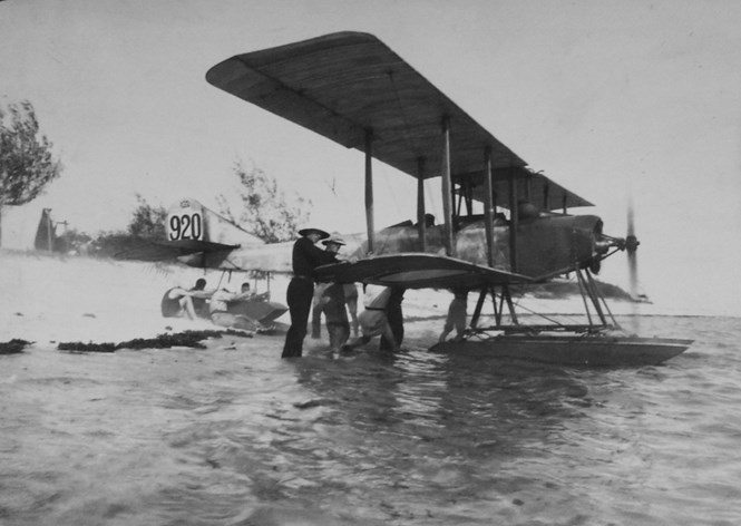 Sopwith Folder No.920 On The Beach At Niororo With The Exposed Engine Running Whilst The Aircraft's Tail Float And Wings Are Held Back.